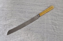 Load image into Gallery viewer, Fine vintage bread or carving knife with cream colour resin handle, Stainless Steel , Made In Sheffield England, 31.5cm long