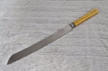 Load image into Gallery viewer, Fine vintage bread or carving knife with cream colour resin handle, Stainless Steel , Made In Sheffield England, 31.5cm long