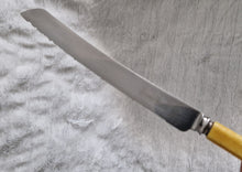 Load image into Gallery viewer, Fine vintage bread or carving knife with cream colour resin handle, Stainless Steel , Made In Sheffield England, 31.5cm long