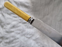Load image into Gallery viewer, Fine vintage bread or carving knife with cream colour resin handle, Stainless Steel , Made In Sheffield England, 31.5cm long