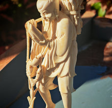 Load image into Gallery viewer, Vintage Asian Fisherman Figurine Resin or Bone Effect Scholar Statue with Fish Carved Figure 19.5cm