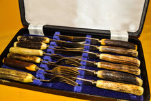 Load image into Gallery viewer, Set of 6 Steak knives and forks with antler handles, approx age from 1970's, gold plated, in box