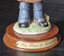 Load image into Gallery viewer, Joy Of time by Leonardo Figurine, Boy with rocking horse toy ceramic figure with wooden plinth base