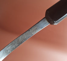 Load image into Gallery viewer, Vintage Boots slotted stainless steel serving spoon black plastic handle , Old Kitchenalia
