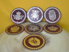Load image into Gallery viewer, Charming Set of 7 Vintage Round Red &amp; Gold Coasters with Coat of Arms Design
