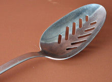 Load image into Gallery viewer, Vintage Boots slotted stainless steel serving spoon black plastic handle , Old Kitchenalia
