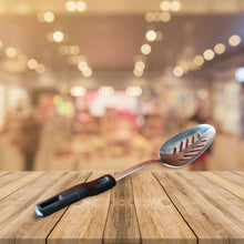 Load image into Gallery viewer, Vintage Boots slotted stainless steel serving spoon black plastic handle , Old Kitchenalia
