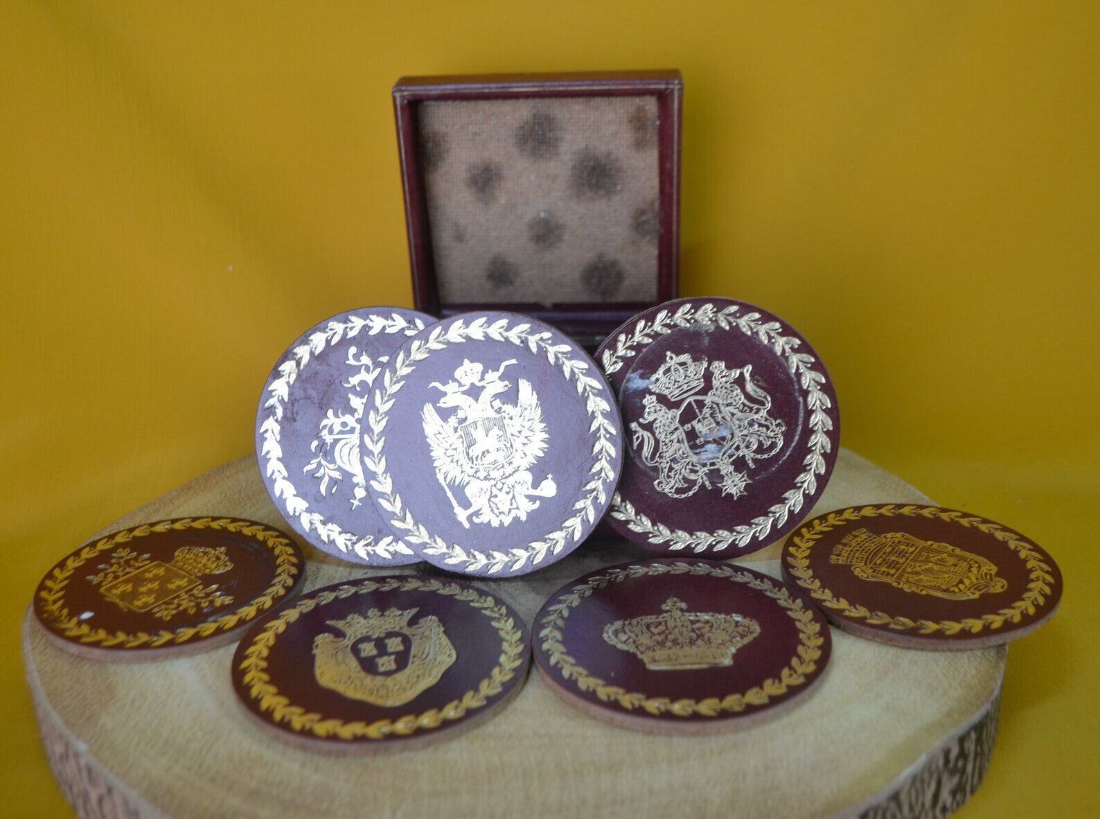 Charming Set of 7 Vintage Round Red & Gold Coasters with Coat of Arms Design