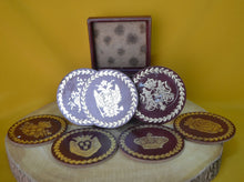 Load image into Gallery viewer, Charming Set of 7 Vintage Round Red &amp; Gold Coasters with Coat of Arms Design
