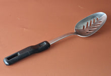 Load image into Gallery viewer, Vintage Boots slotted stainless steel serving spoon black plastic handle , Old Kitchenalia
