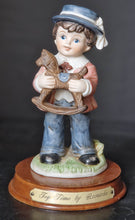 Load image into Gallery viewer, Joy Of time by Leonardo Figurine, Boy with rocking horse toy ceramic figure with wooden plinth base
