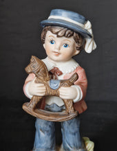 Load image into Gallery viewer, Joy Of time by Leonardo Figurine, Boy with rocking horse toy ceramic figure with wooden plinth base
