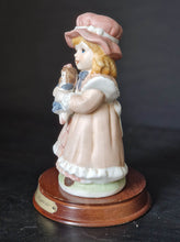 Load image into Gallery viewer, Joy Of time by Leonardo Figurine, Girl with rocking doll ceramic figure with wooden plinth base
