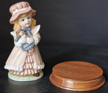Load image into Gallery viewer, Joy Of time by Leonardo Figurine, Girl with rocking doll ceramic figure with wooden plinth base
