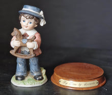 Load image into Gallery viewer, Joy Of time by Leonardo Figurine, Boy with rocking horse toy ceramic figure with wooden plinth base
