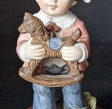 Load image into Gallery viewer, Joy Of time by Leonardo Figurine, Boy with rocking horse toy ceramic figure with wooden plinth base
