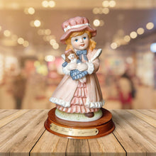 Load image into Gallery viewer, Joy Of time by Leonardo Figurine, Girl with rocking doll ceramic figure with wooden plinth base
